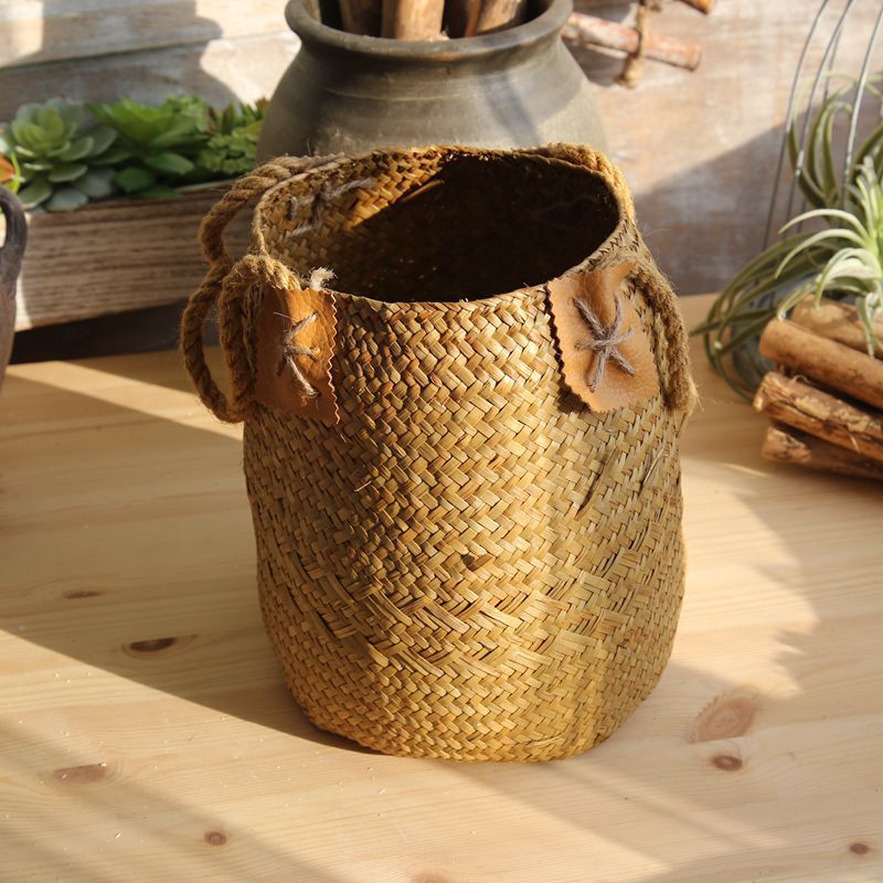 Woven seagrass basket styled on shelf home organization